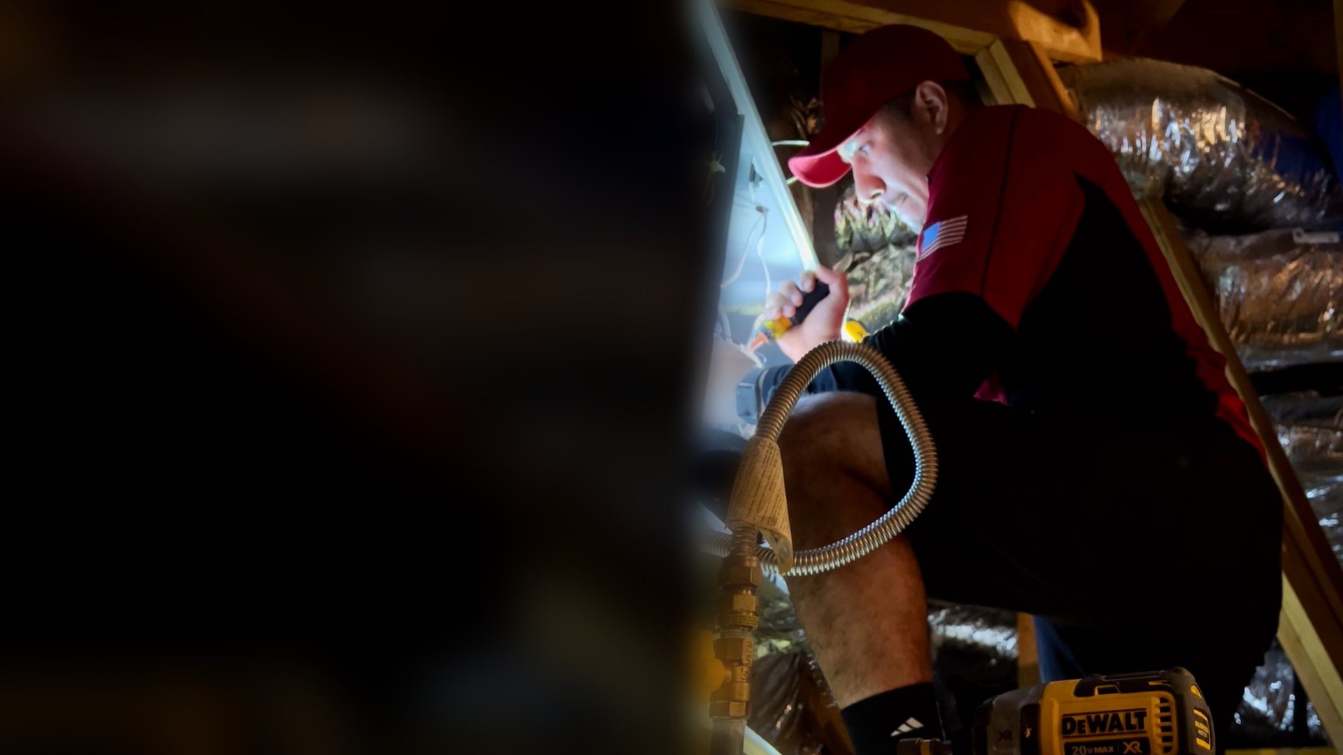 An ATC Heating and Air technician brazing a line set in a Texas attic